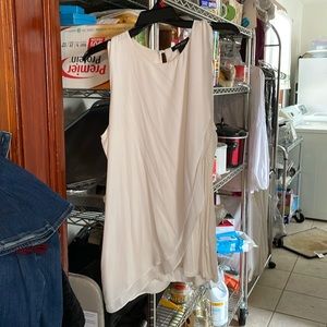 White sleeveless top.